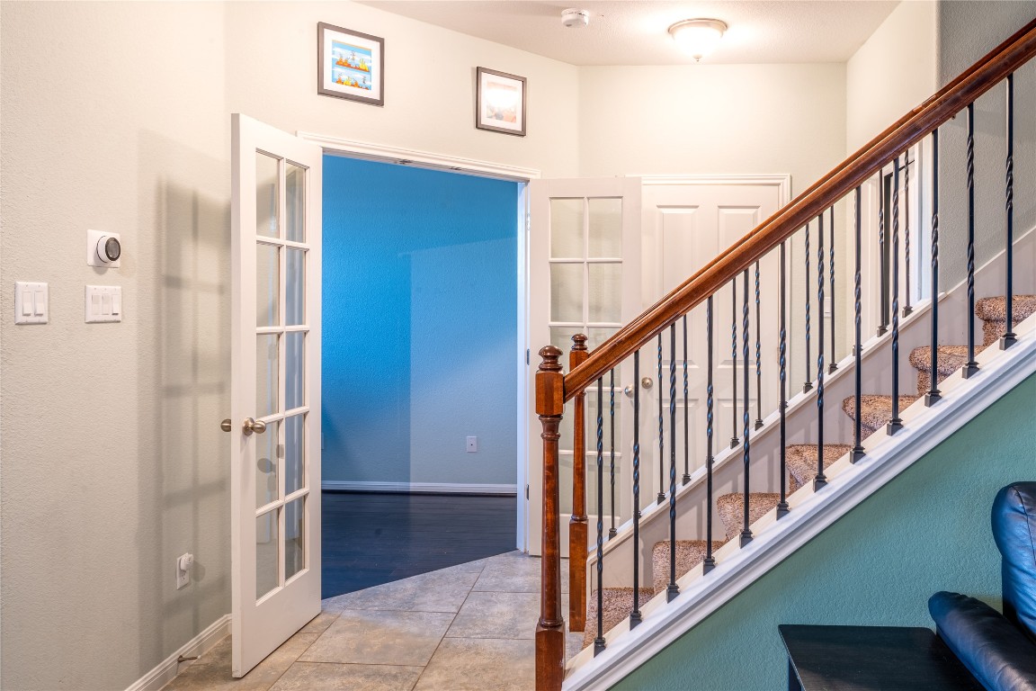 3006 Sea Jay Drive Austin, TX 78745 - Photo 8 of 22 Stairs featuring tile patterned floors