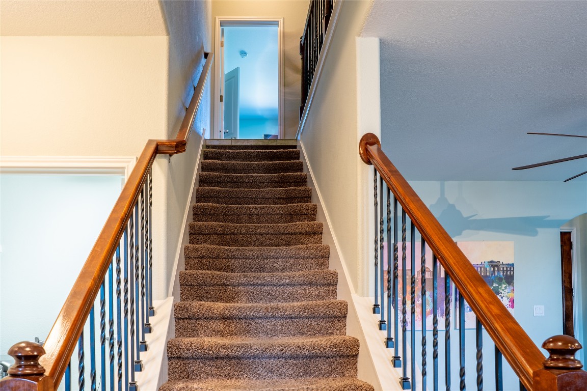 3006 Sea Jay Drive Austin, TX 78745 - Photo 10 of 22 Stairway with a ceiling fan