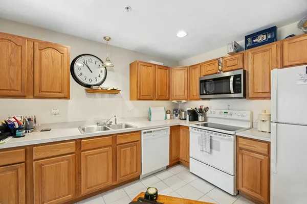 a kitchen with a sink cabinets and stainless steel appliances