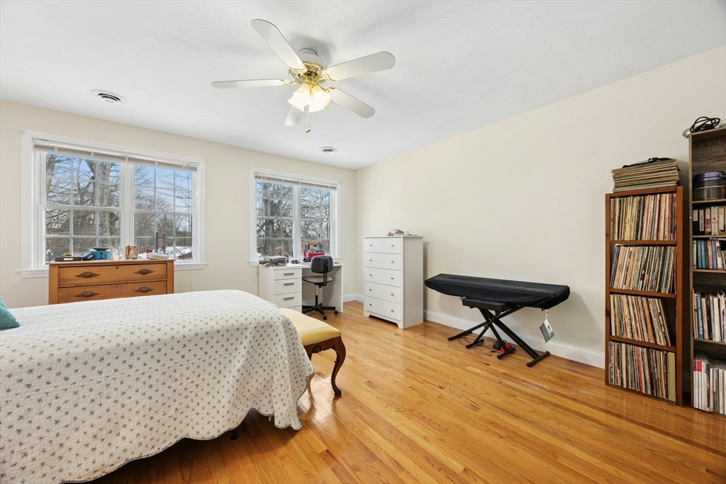 22 Village Way, Unit 22 Rutland, MA 01543 - Photo 19 of 39 a bedroom with a bed and wooden floor