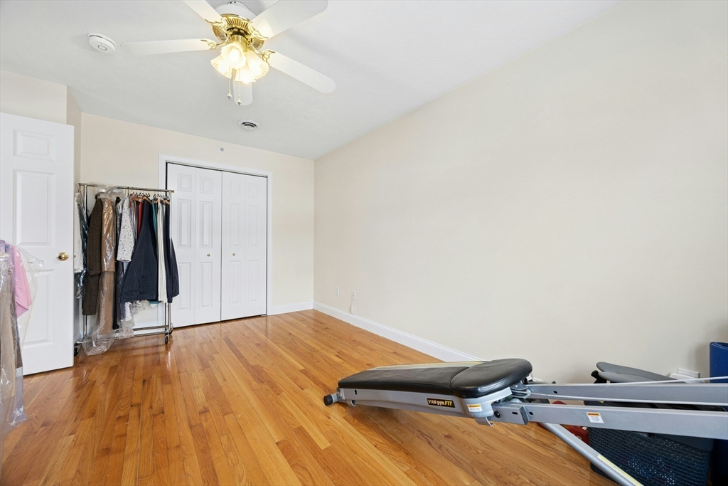 22 Village Way, Unit 22 Rutland, MA 01543 - Photo 20 of 39 a view of a room with a hardwood floor and ceiling fan