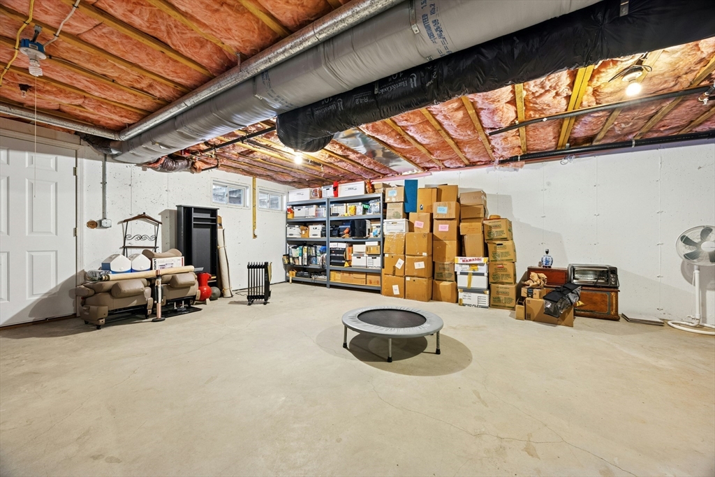 22 Village Way, Unit 22 Rutland, MA 01543 - Photo 23 of 39 a view of a garage with parked cars