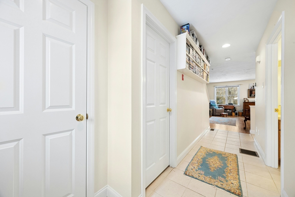22 Village Way, Unit 22 Rutland, MA 01543 - Photo 3 of 39 a view of a hallway view with wooden floor and living room
