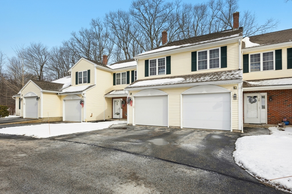 22 Village Way, Unit 22 Rutland, MA 01543 - Photo 33 of 39 a front view of a house with a garage