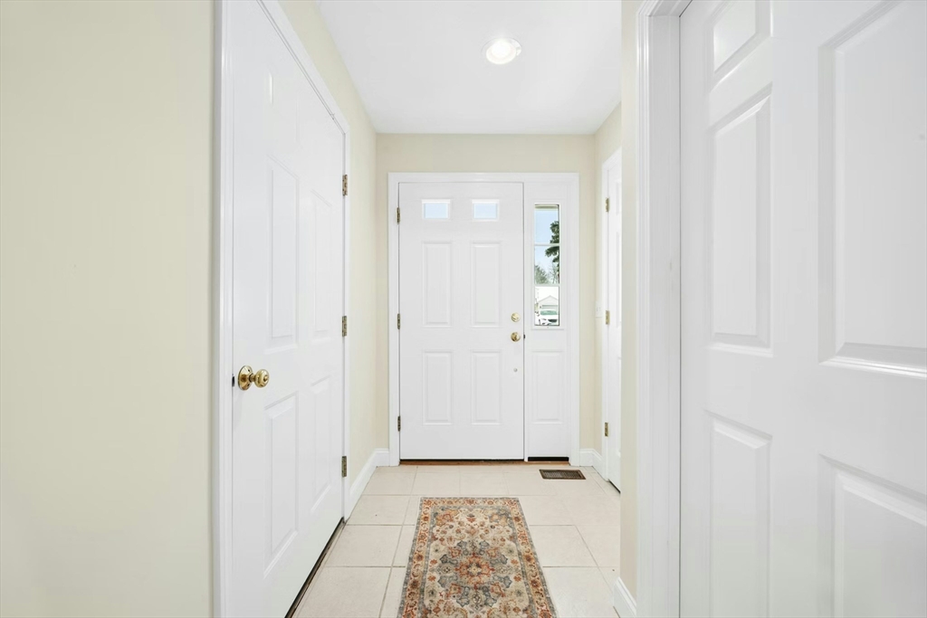 22 Village Way, Unit 22 Rutland, MA 01543 - Photo 36 of 39 a view of a hallway with wooden floor