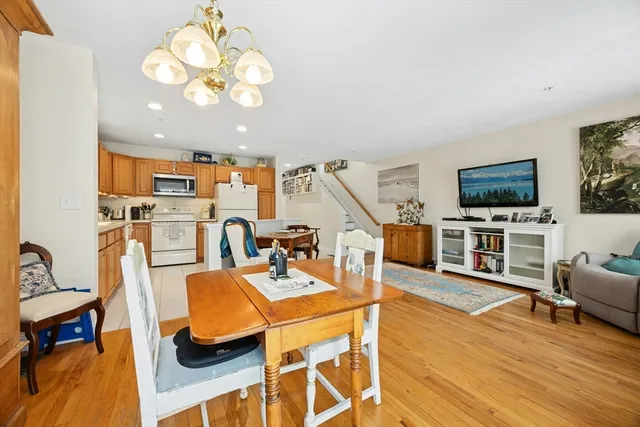 a view of a dining room with furniture and a flat screen tv