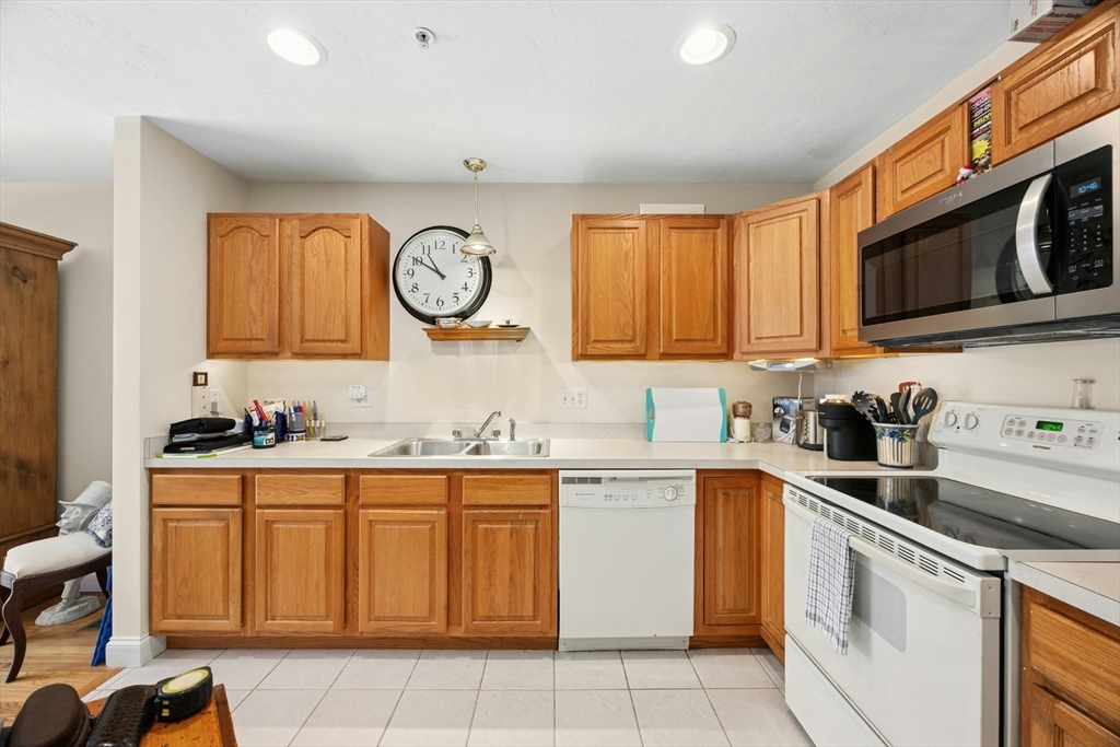 22 Village Way, Unit 22 Rutland, MA 01543 - Photo 6 of 39 a kitchen with a sink and cabinets
