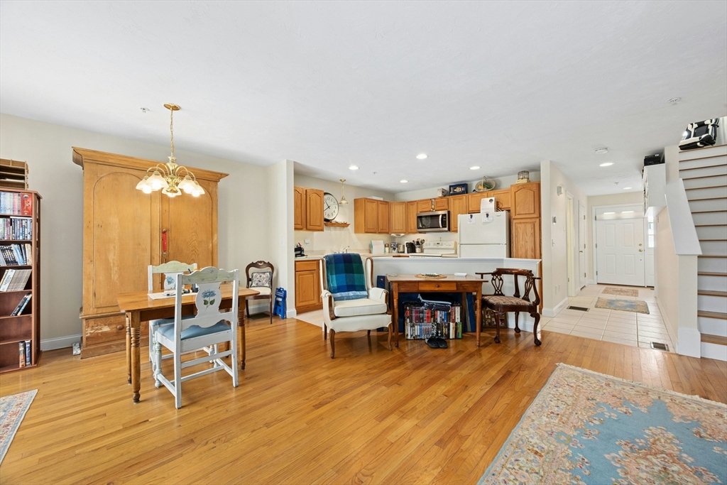 22 Village Way, Unit 22 Rutland, MA 01543 - Photo 10 of 39 a view of a dining room with furniture and wooden floor