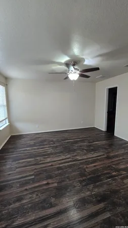 a view of a room with wooden floor