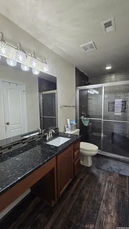 a bathroom with a sink and mirror