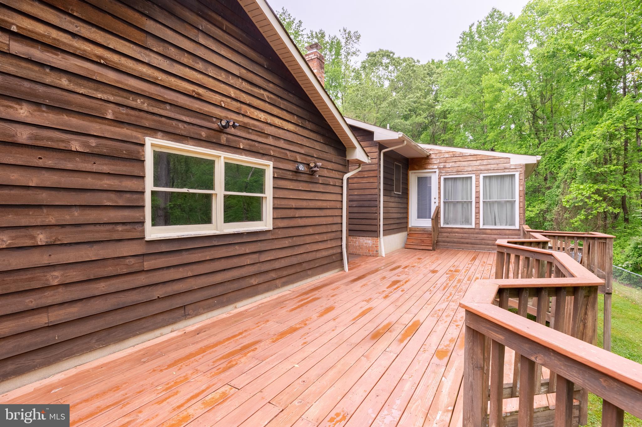 5218 Caledon Road King George, VA 22485 - Photo 14 of 59 Rear deck (JUST STAINED) connects home and garage