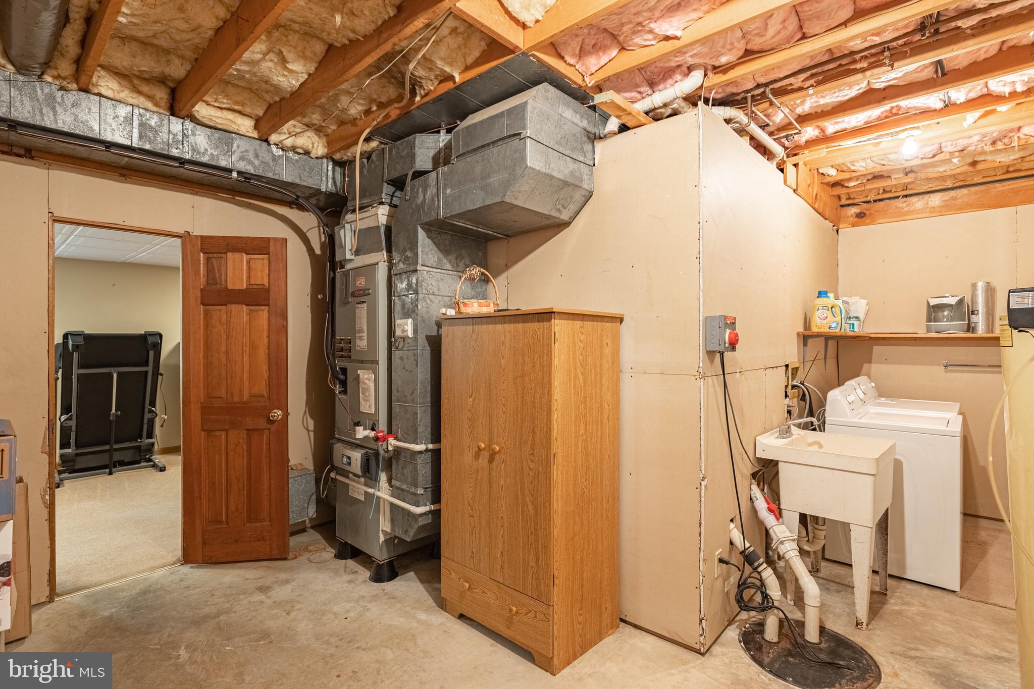 5218 Caledon Road King George, VA 22485 - Photo 44 of 59 Sink in laundry room, and storage area