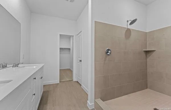 a bathroom with a sink and shower