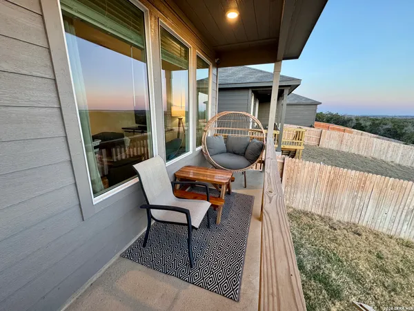 a view of balcony with sunset view