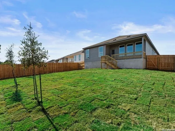a view of a balcony with wooden floor and lake view
