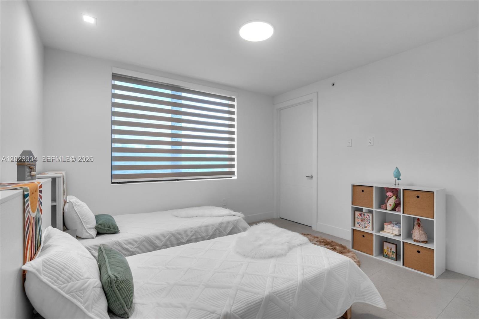 721 Southwest 11th Street, Unit G Miami, FL 33129 - Photo 23 of 40 a bedroom with a bed and a window