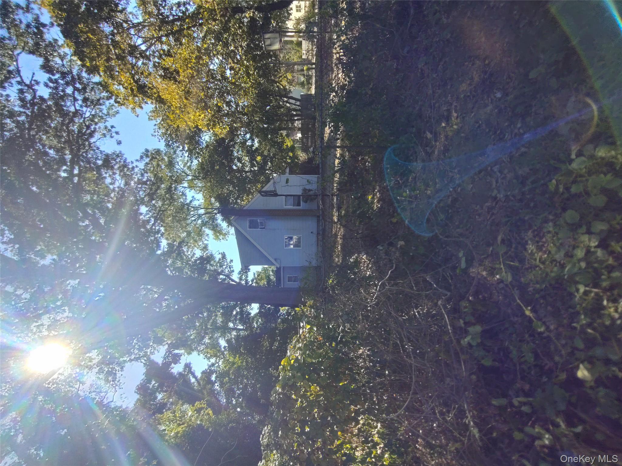 16 Neighborhood Road Mastic Beach, NY 11951 - Photo 3 of 4 a view of a yard in a yard