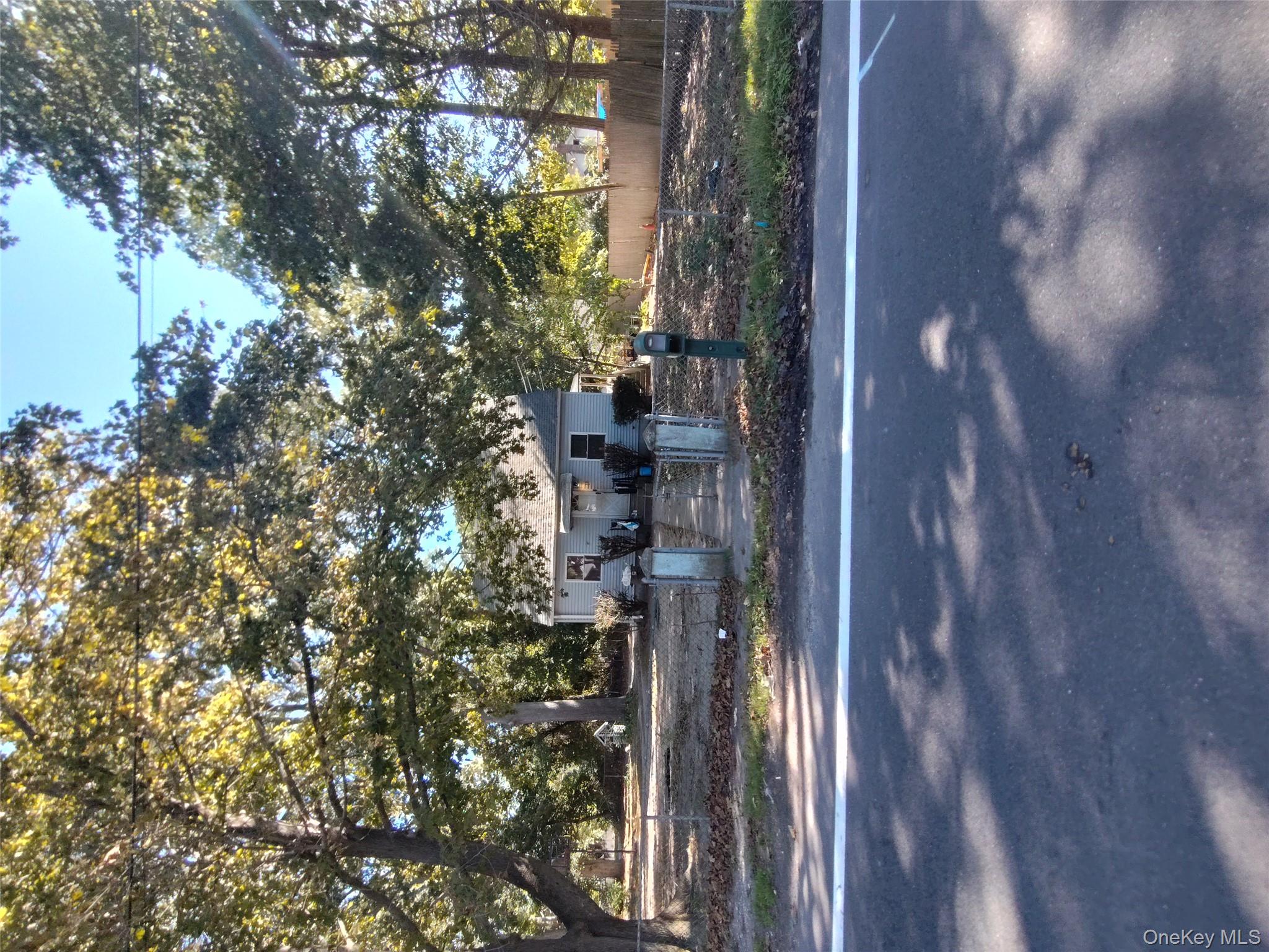 16 Neighborhood Road Mastic Beach, NY 11951 - Photo 4 of 4 a house view with a outdoor space