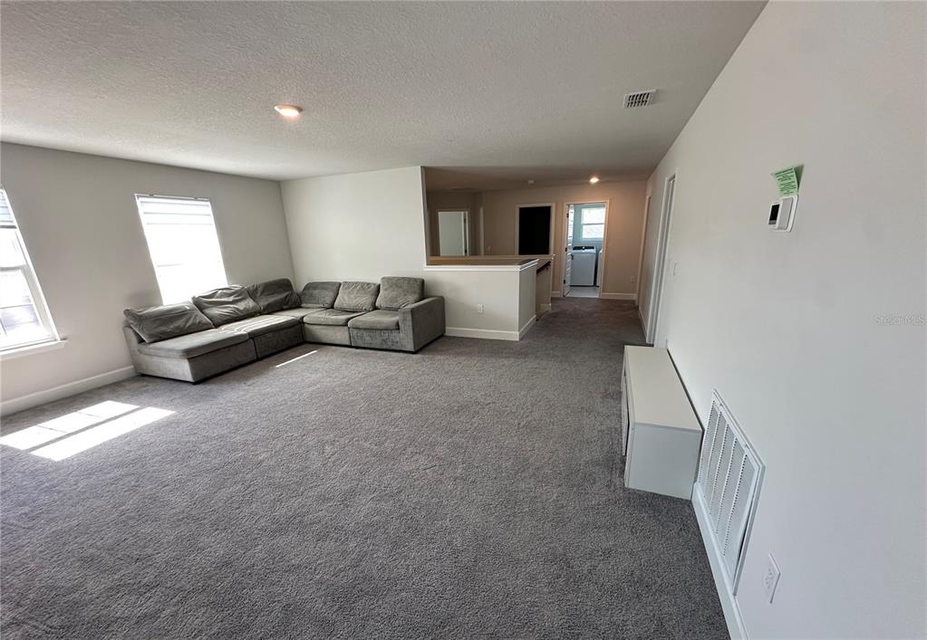 36097 Welsh Glade Road Dade City, FL 33525 - Photo 20 of 35 a living room with furniture and a window