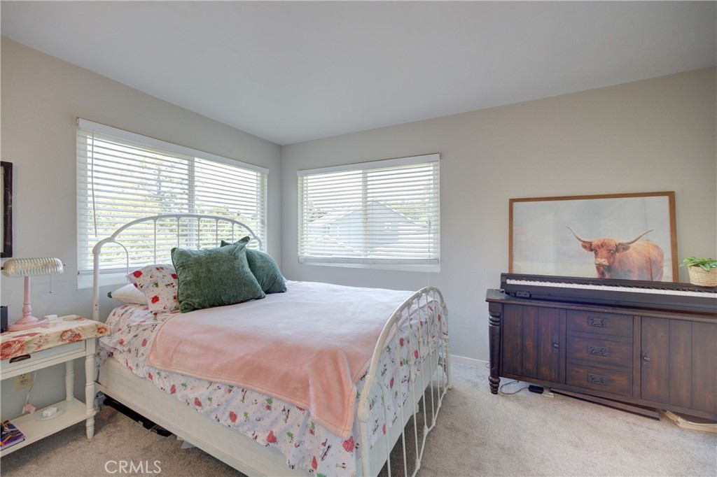 2650 Main Street, Unit 7 Cambria, CA 93428 - Photo 25 of 50 a bedroom with a bed and a window