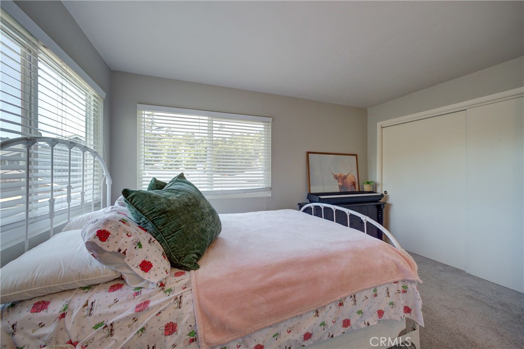 2650 Main Street, Unit 7 Cambria, CA 93428 - Photo 26 of 50 a bedroom with a bed and a window