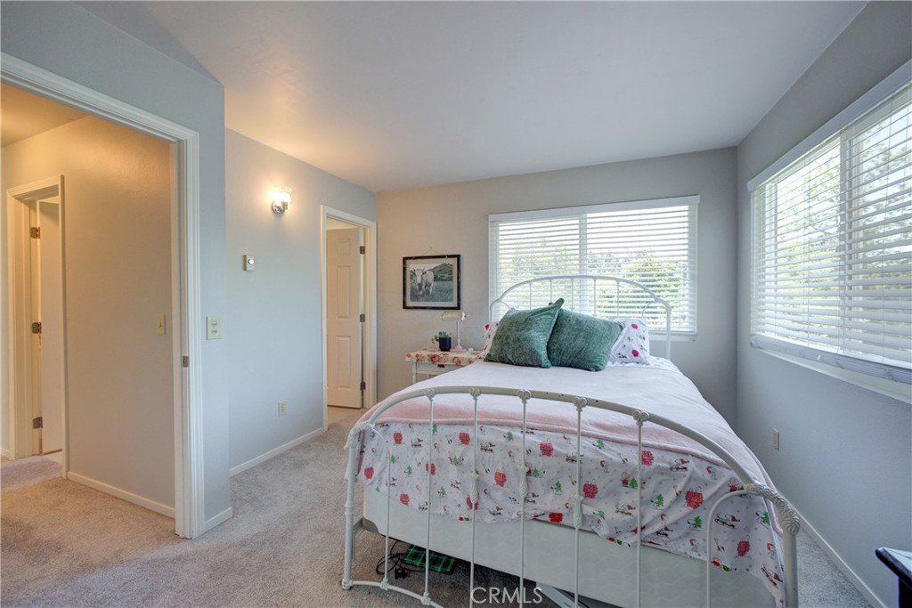 2650 Main Street, Unit 7 Cambria, CA 93428 - Photo 27 of 50 a bedroom with a bed and a window