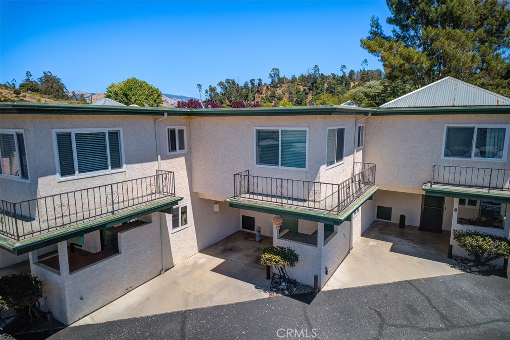 2650 Main Street, Unit 7 Cambria, CA 93428 - Photo 45 of 50 a view of a house with a wooden deck and furniture