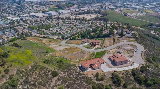 an aerial view of residential house and car parked