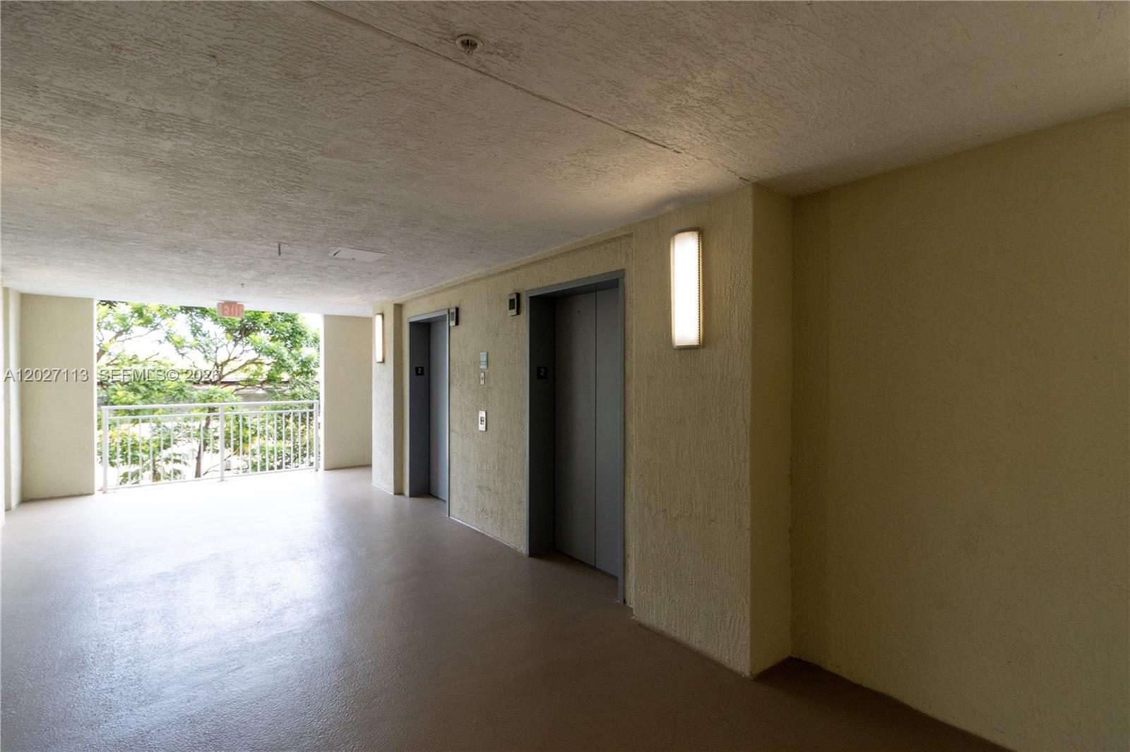 7275 Southwest 90th Way, Unit 213 Miami, FL 33156 - Photo 5 of 31 an empty room with windows