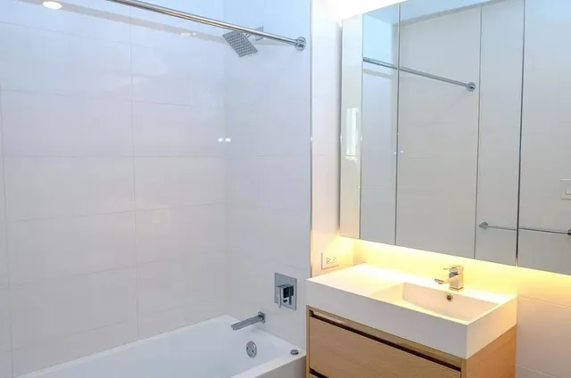 a bathroom with a sink and a bathtub