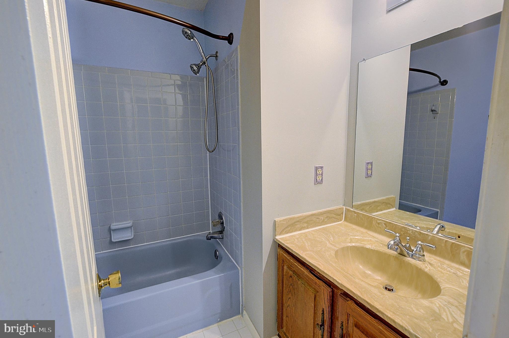 14417 Jaystone Drive Silver Spring, MD 20905 - Photo 27 of 30 a bathroom with a sink and a mirror