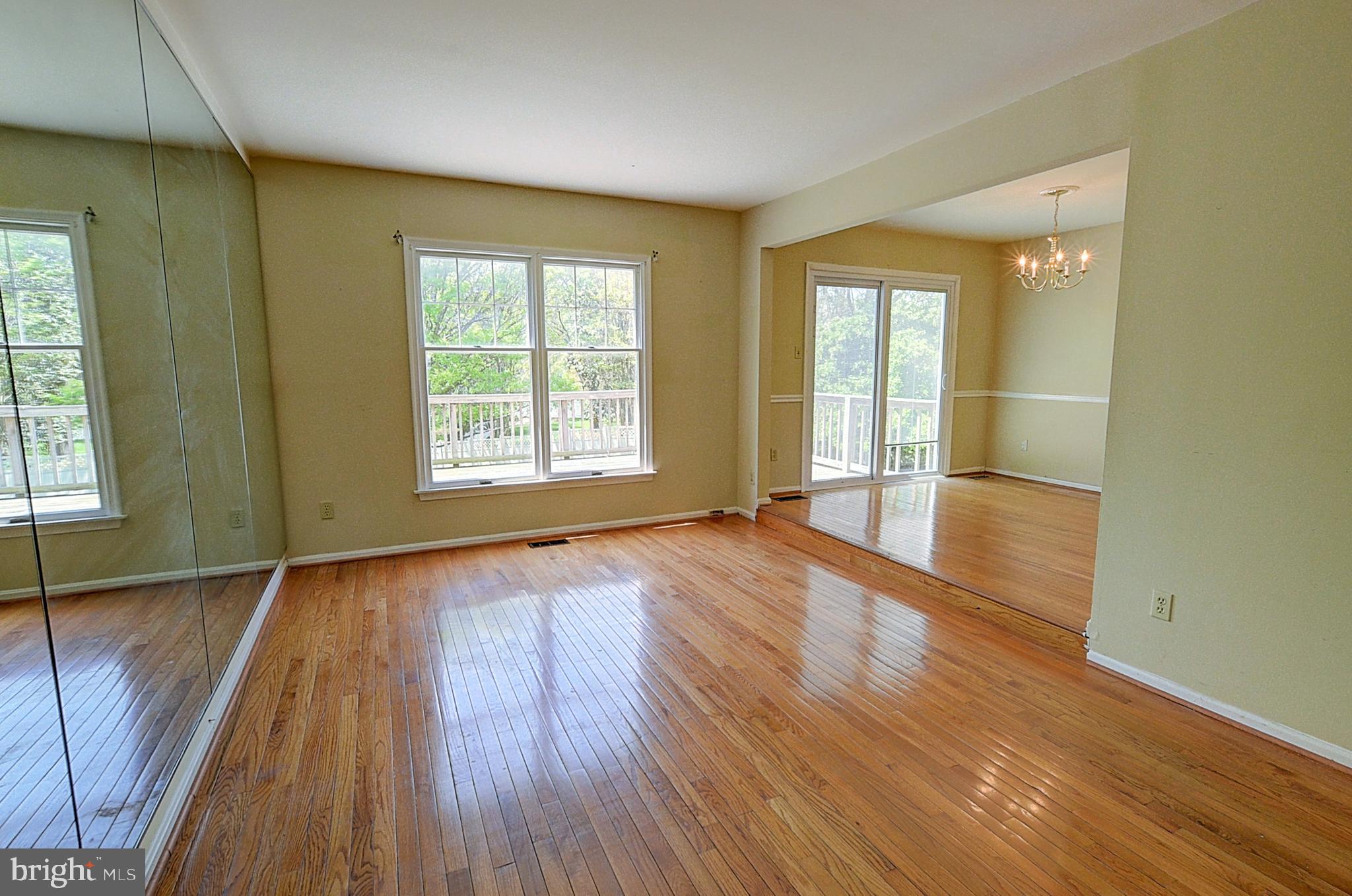 14417 Jaystone Drive Silver Spring, MD 20905 - Photo 3 of 30 an empty room with wooden floor and windows