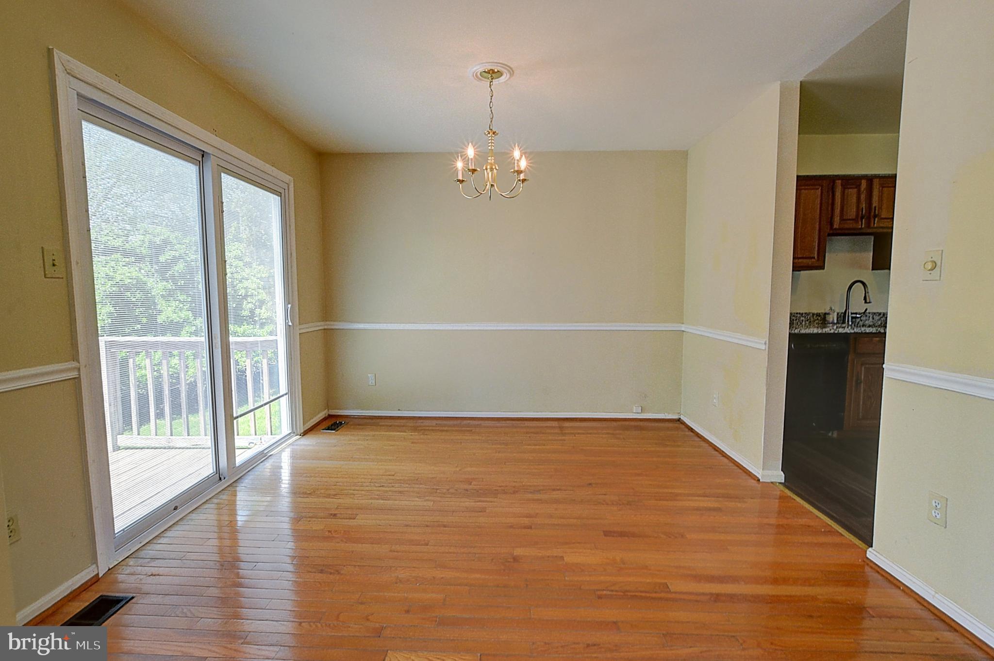 14417 Jaystone Drive Silver Spring, MD 20905 - Photo 5 of 30 an empty room with wooden floor and windows