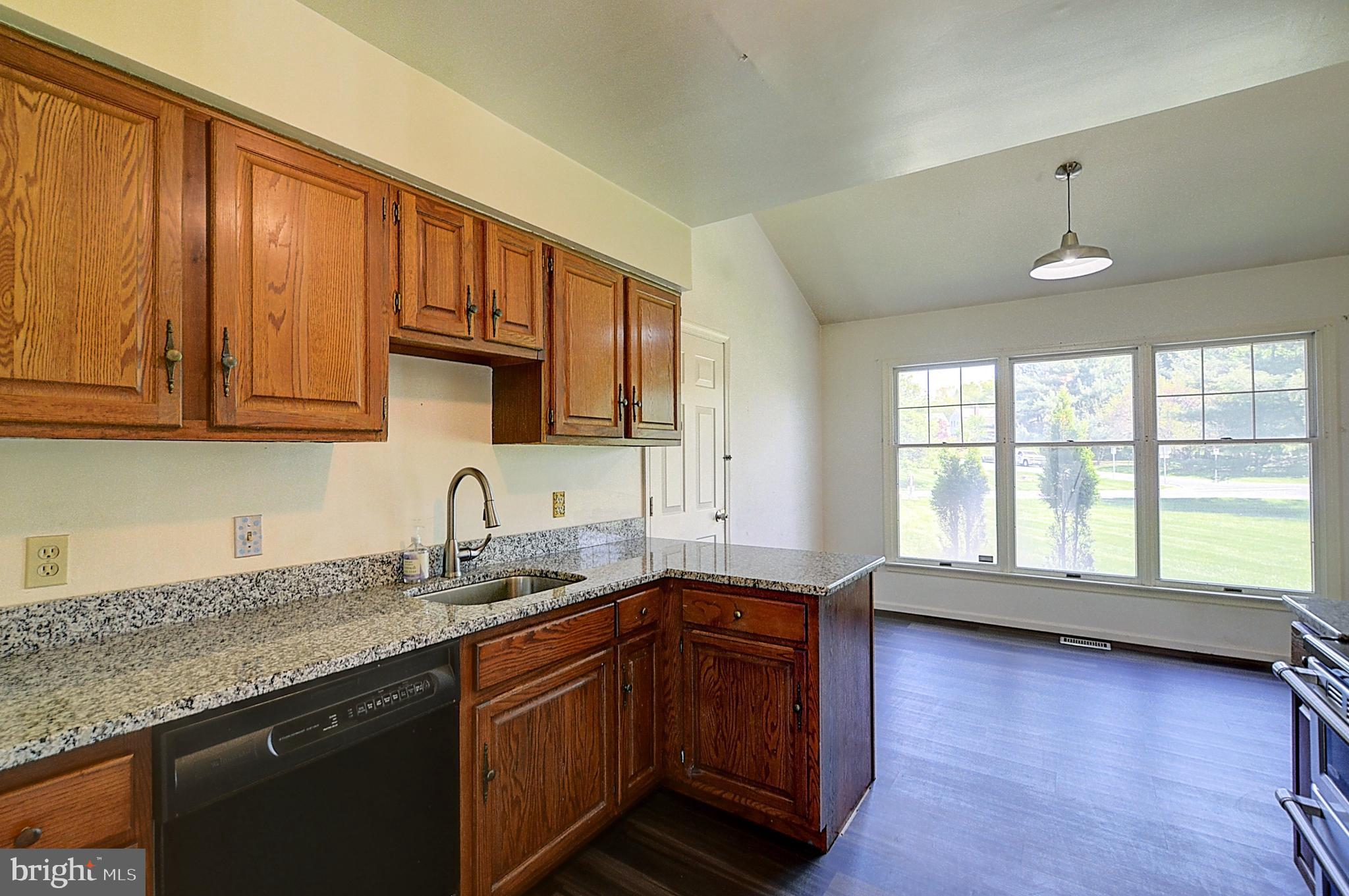 14417 Jaystone Drive Silver Spring, MD 20905 - Photo 8 of 30 a kitchen with granite countertop wooden cabinets a sink and dishwasher