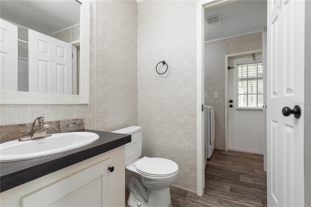 1688 Papaya Street Bunnell, FL 32110 - Photo 28 of 63 a bathroom with a sink toilet and shower