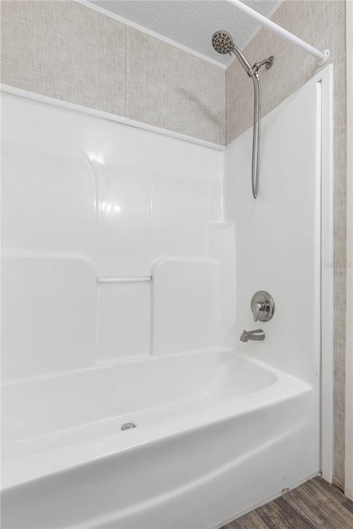1688 Papaya Street Bunnell, FL 32110 - Photo 29 of 63 a bathroom with a bathtub
