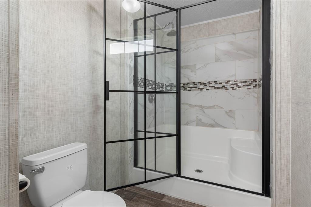 1688 Papaya Street Bunnell, FL 32110 - Photo 3 of 63 a bathroom with a shower