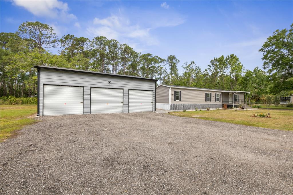 1688 Papaya Street Bunnell, FL 32110 - Photo 35 of 63 a house with trees in the background