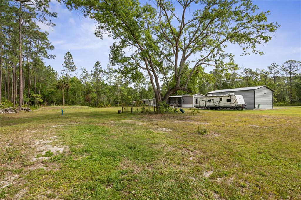 1688 Papaya Street Bunnell, FL 32110 - Photo 45 of 63 a front view of a house with a yard