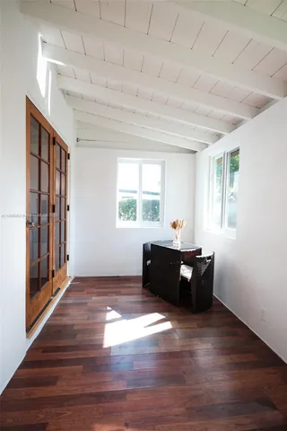 a bathroom with a sink a window and a shower