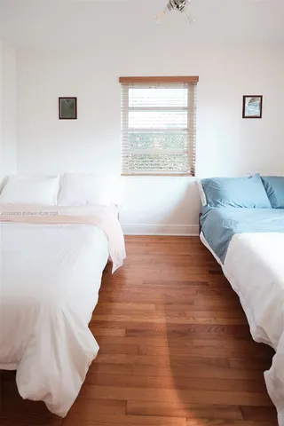 a living room with flat screen tv and a fireplace