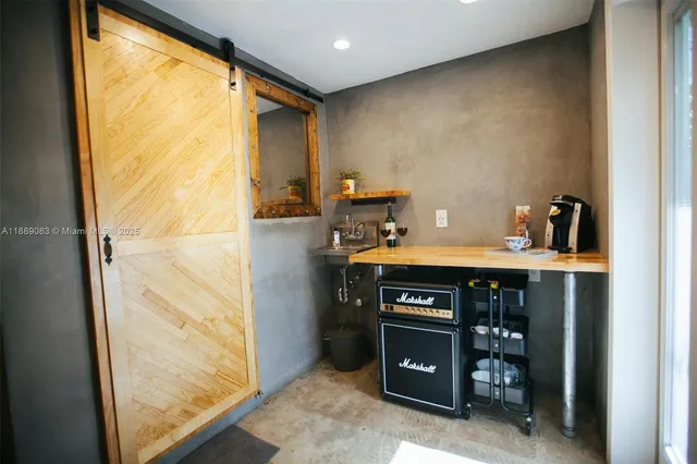 a living room with a bed furniture and a flat screen tv