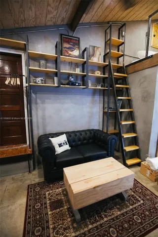a view of a dining room with furniture and window