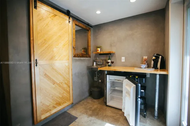 a living room with furniture rug and a window