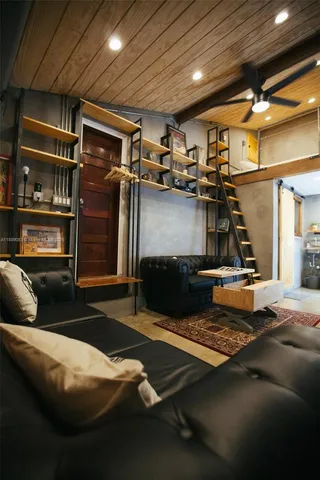 a bathroom with a sink a toilet a mirror and shower