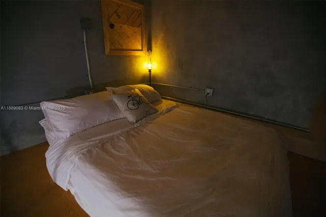 a dining room with furniture a chandelier and wooden floor