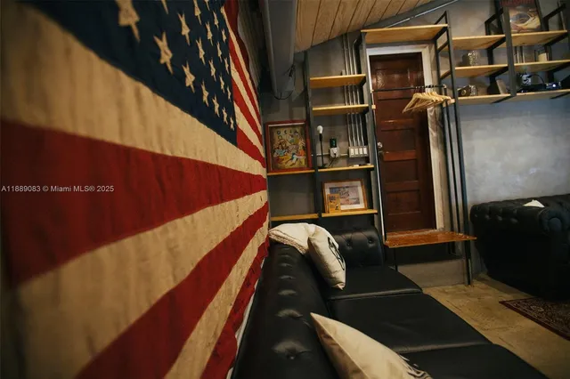 a view of a house with a yard and a fire pit