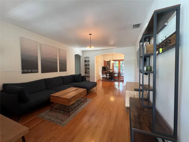 a bedroom with a bed and a table