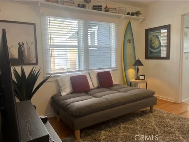 404 9th Street Huntington Beach, CA 92648 - Photo 11 of 19 a living room with a couch and a window