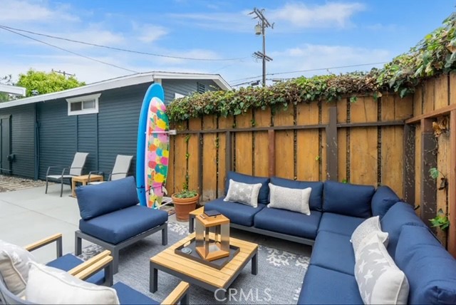 404 9th Street Huntington Beach, CA 92648 - Photo 4 of 19 a outdoor living space with furniture and a potted plant
